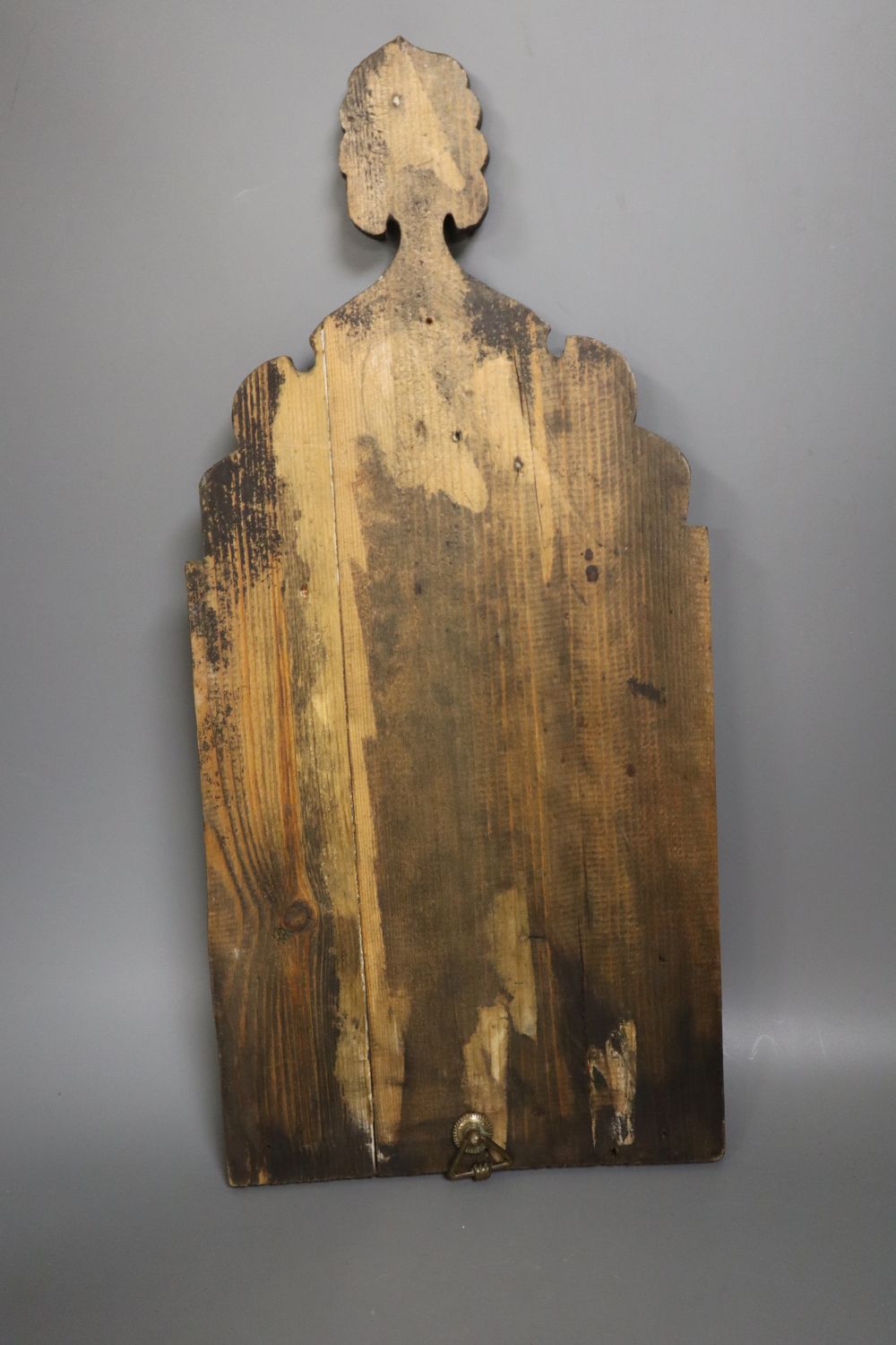 An Indian painted wall mirror, height 46cm
